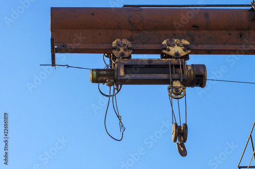 gantry crane, telpher, old, ancient, past, broken, abandoned, rusty, closed production, work; orange; metal; environment; vintage; old; ancient; past; broken; abandoned; rusty; closed production photo