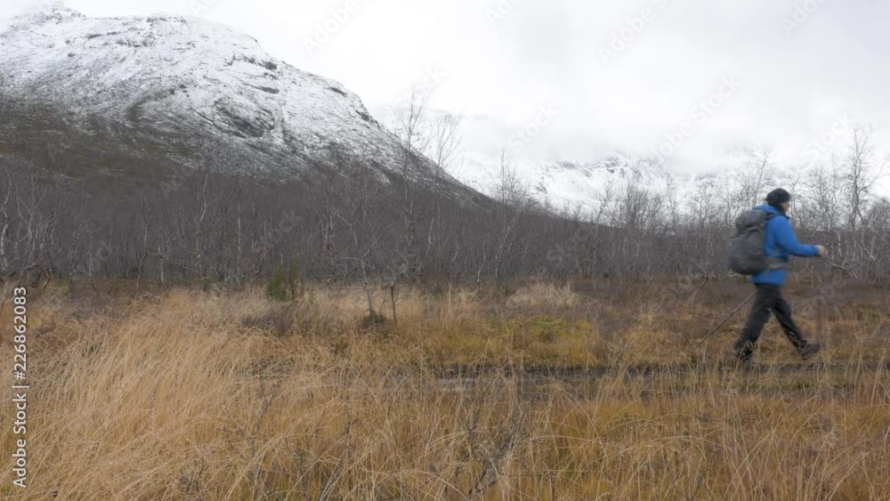 A man travels with a backpack. Hiking adventures. He leads an active and healthy life A man travels with a backpack. Hiking adventures. He leads an active and healthy life