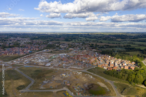 Aerial new housing estate construction on green belt land UK