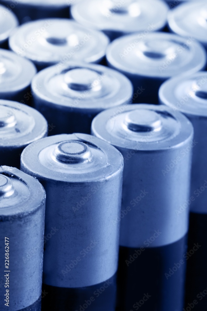 Row of AA Alkaline Batteries Close-Up Row of AA Alkaline Batteries Close-Up