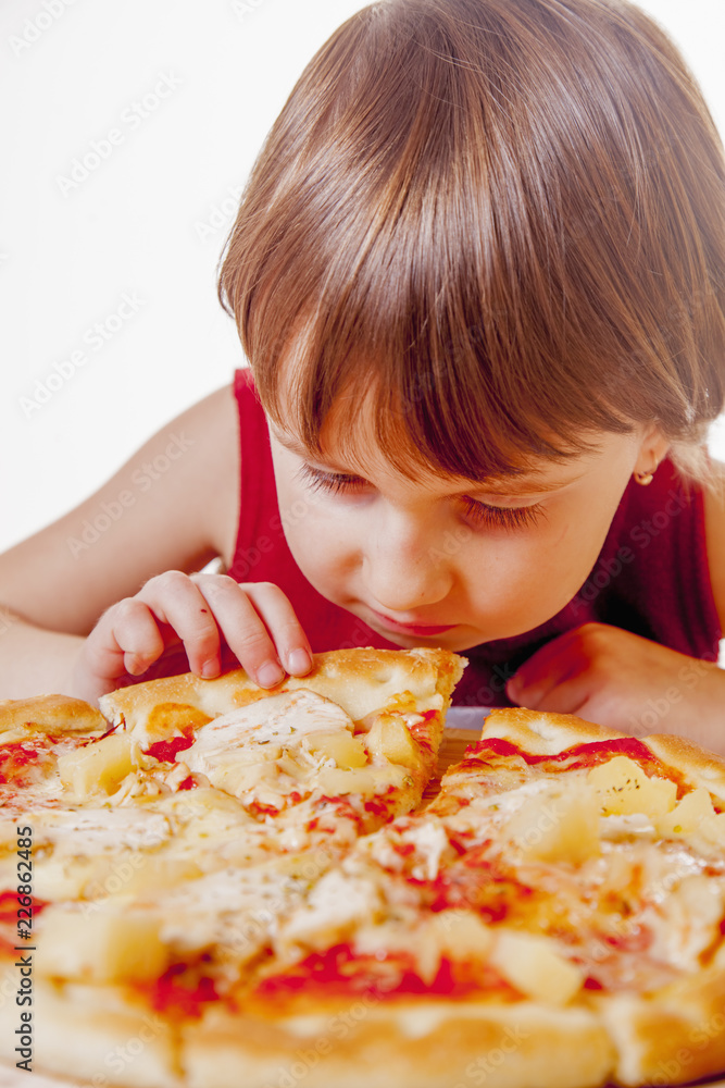 Time to eat! Cute little young girl eating a piece of pizzaa. Happy child having fun eating dinner. Time to eat! Cute little young girl eating a piece of pizzaa. Happy child having fun eating dinner.