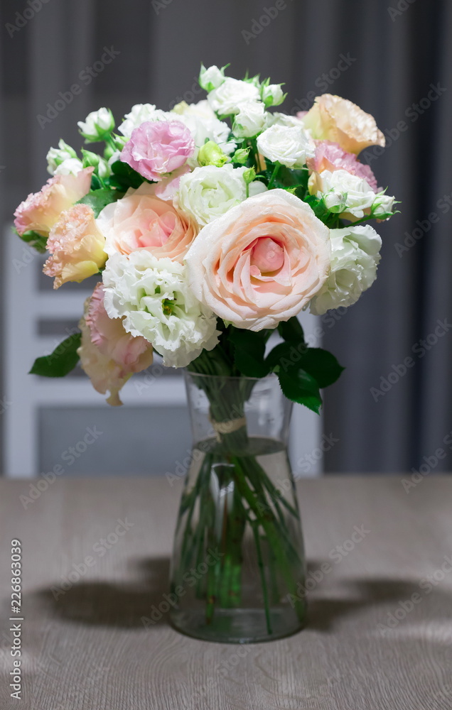 Fototapeta Interior. Bouquet roses on the kitchen table