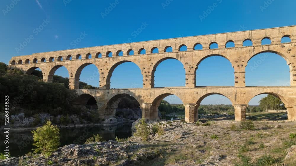 Time lapse hyperlapse of the 2000 years old roman Pont du Gard Aqueduct Bridge in France near Nimes Time lapse hyperlapse of the 2000 years old roman Pont du Gard Aqueduct Bridge in France near Nimes