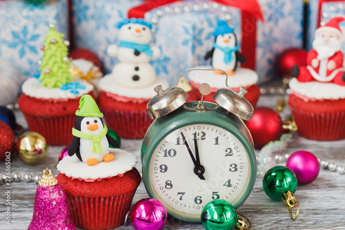 Christmas cupcake with colored decorations, soft focus background