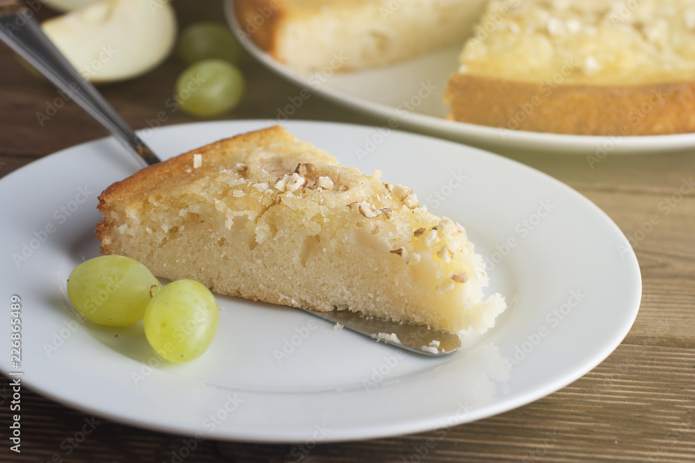 Homemade apple pie with nuts. Autumn food concept. Pie and fall fruits: apples, grapes and nuts. Homemade apple pie with nuts. Autumn food concept. Pie and fall fruits: apples, grapes and nuts.