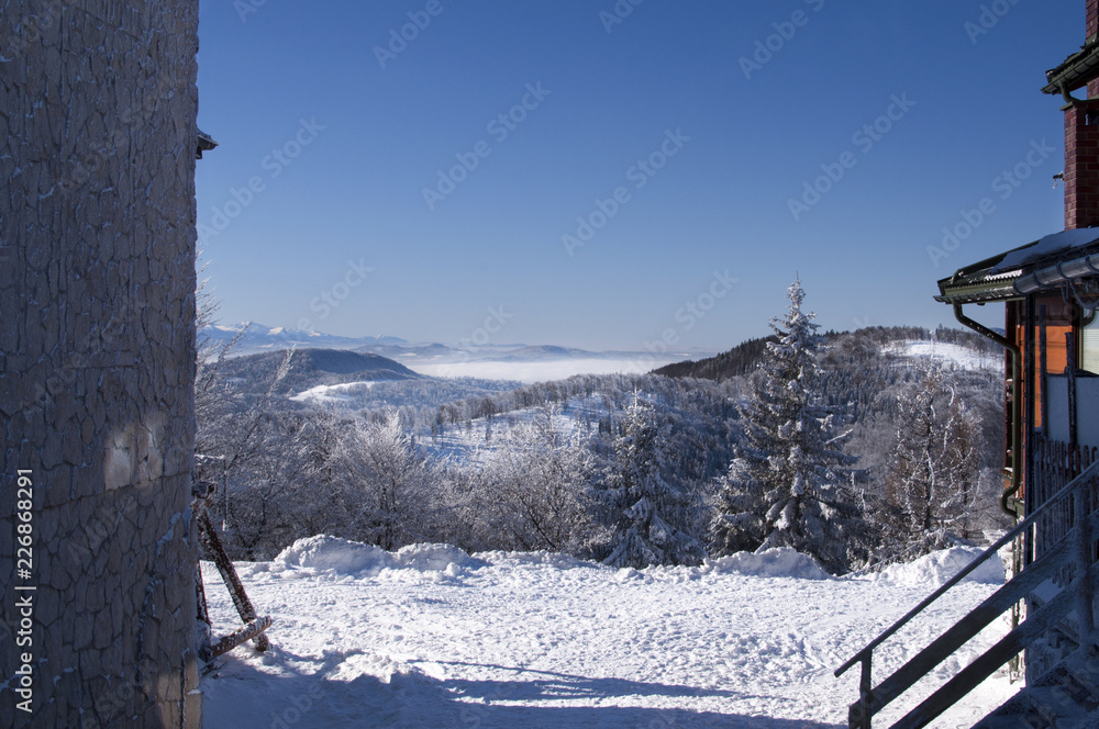 Fototapeta premium winter mountains up above the clouds