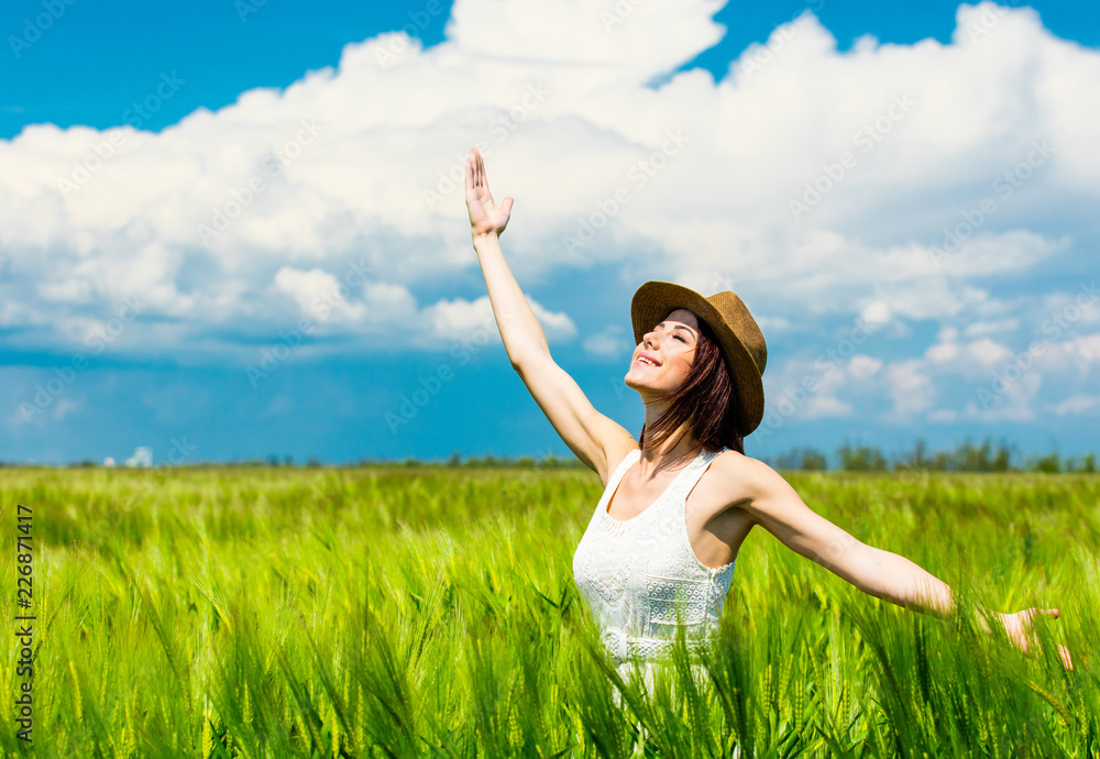 portrait of the beautiful young woman standing in the field portrait of the beautiful young woman standing in the field