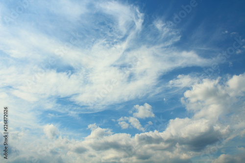 Beautiful blue sky and white cirrus and cumulus clouds. Background. Landscape.