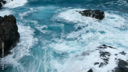 ocean waves on rocks - surf hits cliff on rocky coast