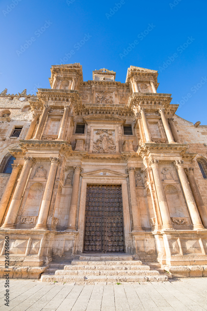 Fototapeta premium facade of Saint Mary of the Assumption church, landmark and baroque monument from year 1627, in Gumiel de Izan, village in Burgos, Spain, Europe