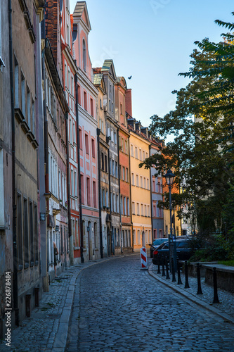 Wroclaw street in the evening. Old houses at sunset.