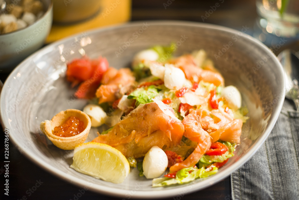 salad with salmon, caviar, vegetables, herbs and lemon share, salad with fish and vegetables salad with salmon, caviar, vegetables, herbs and lemon share, salad with fish and vegetables