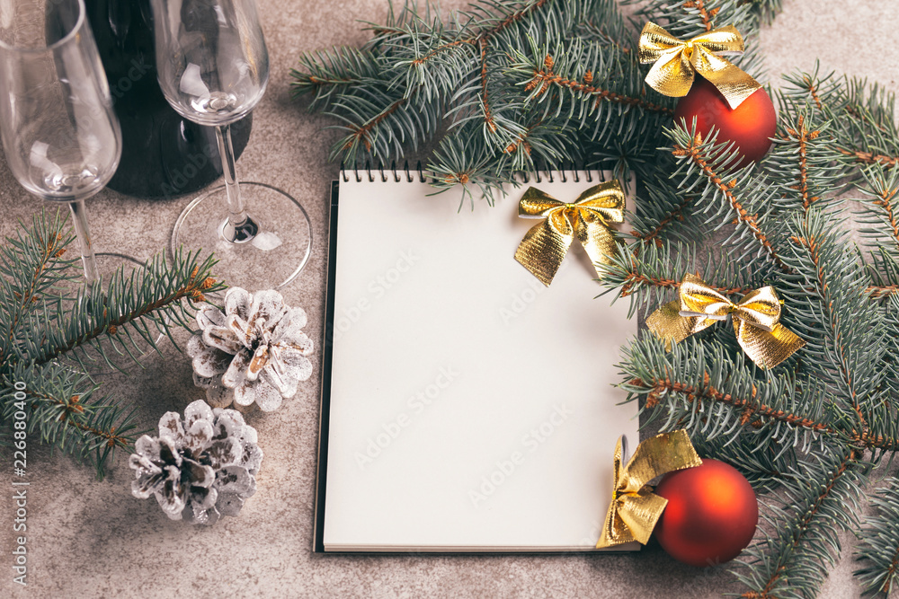 Scratchpad for wishes with Christmas decorations on slate bacground Scratchpad for wishes with Christmas decorations on slate bacground