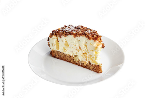 Yoghurt cake with ananas on a white plate and white background. Isolated.