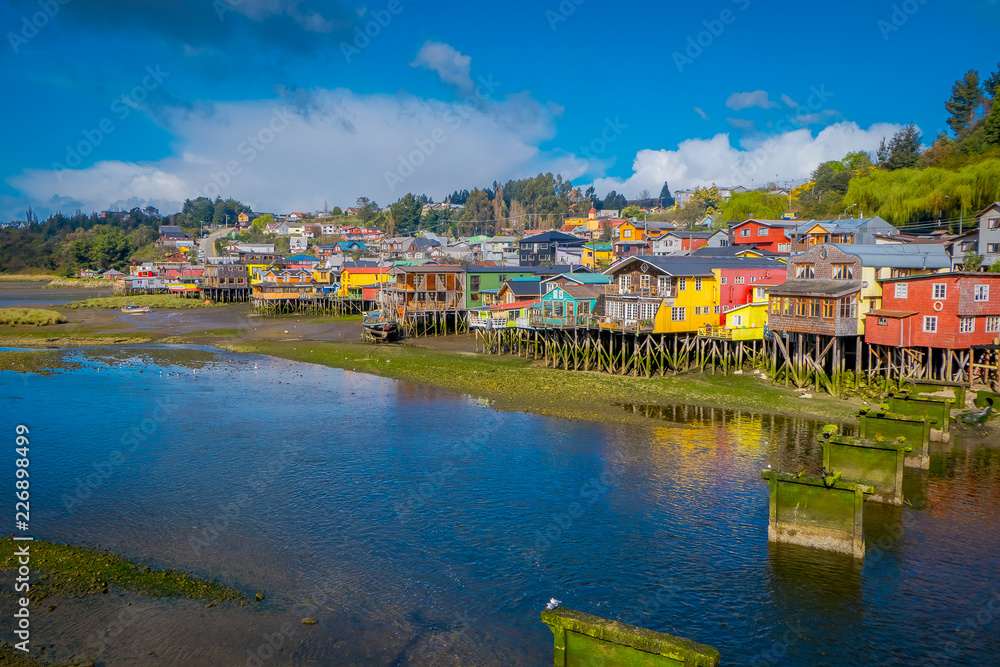 Beautiful coorful houses on stilts palafitos in Castro, Chiloe Island