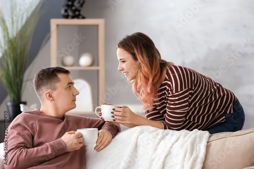 Cute young loving couple dr...