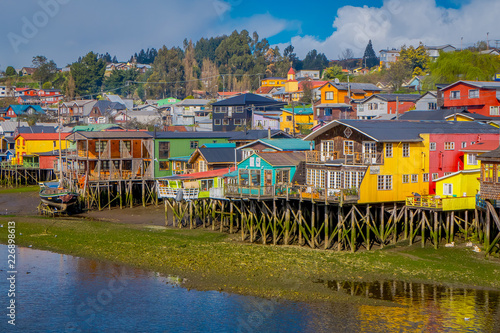 Beautiful coorful houses on stilts palafitos in Castro, Chiloe Island photo