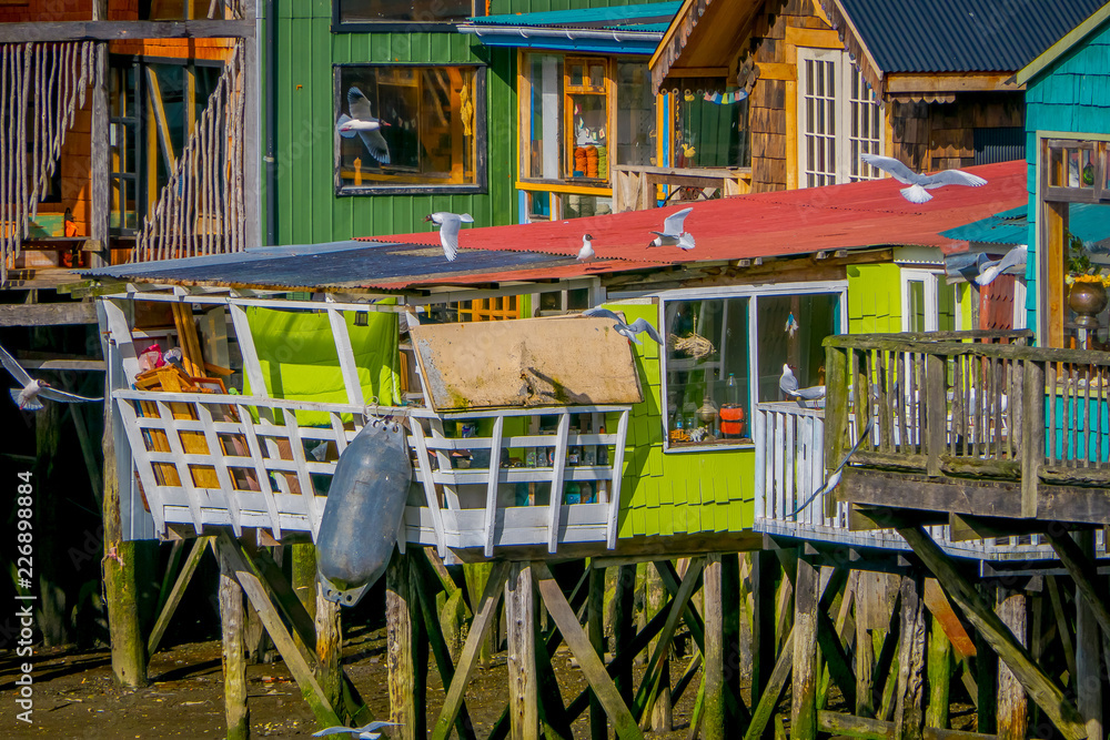 Beautiful coorful houses on stilts palafitos in Castro, Chiloe Island