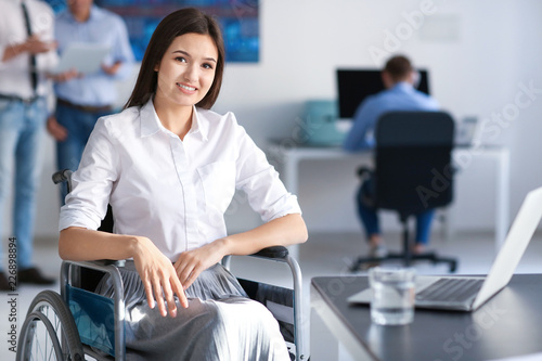 Young woman in wheelchair a...