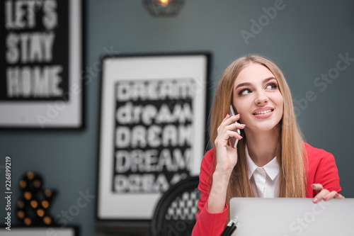 Young woman talking on cell...