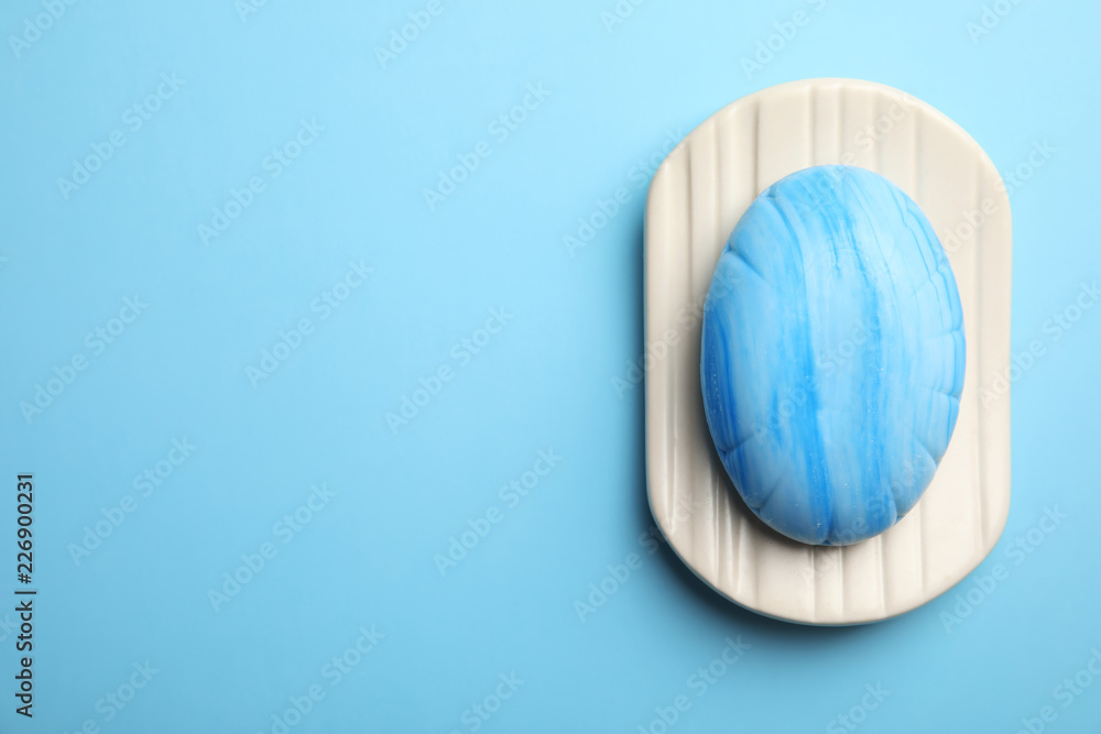 Ταπετσαρία Holder with soap bar on color background, top view