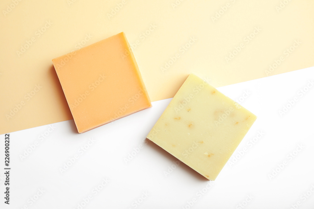 Hand made soap bars on color background, top view Hand made soap bars on color background, top view