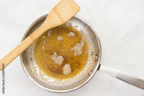 Browned Butter in a Skillet with a Wood Spatula