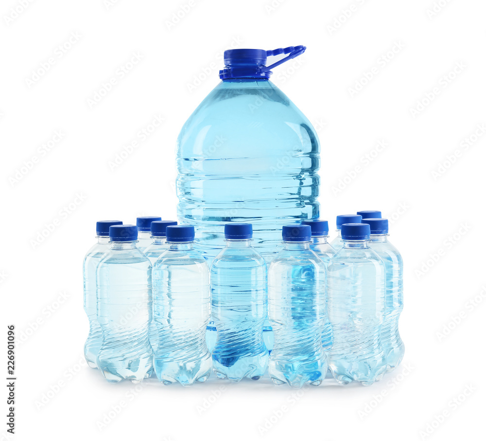 Large and small bottles of water on white background Large and small bottles of water on white background