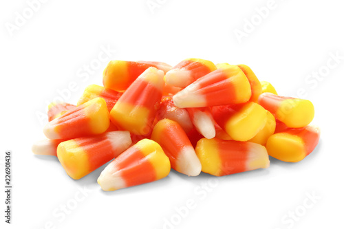 Colorful candy corns for Halloween party on white background