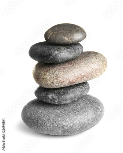 Stack of zen spa stones on white background