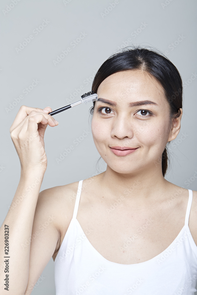 woman with cosmetics brush woman with cosmetics brush