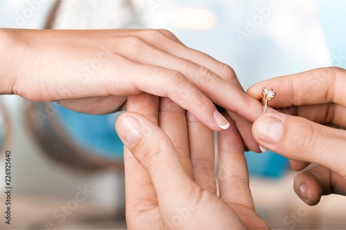 Groom Putting the Wedding Ring