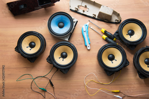 Tweaking audio. Car audio speakers on a work table. photo