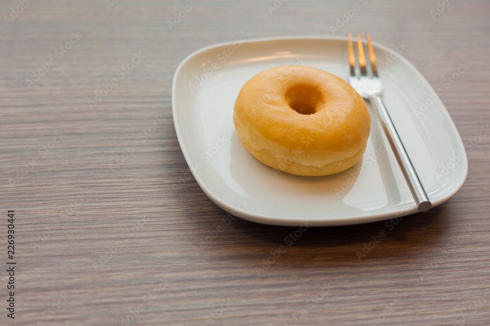 Plain donuts on wooden table Plain donuts on wooden table