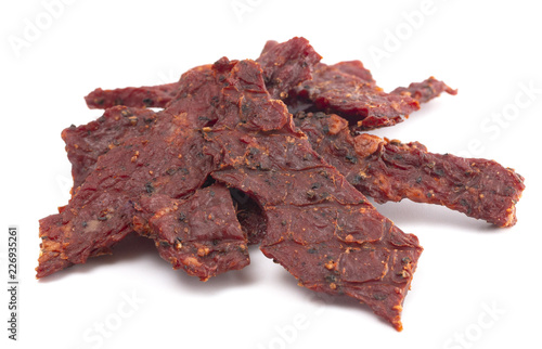 Pile of Black Pepper Beef Jerky on a White Background