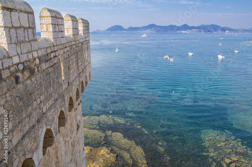 The ruins of Lérins Abbey overlook the azure ocean at Cannes