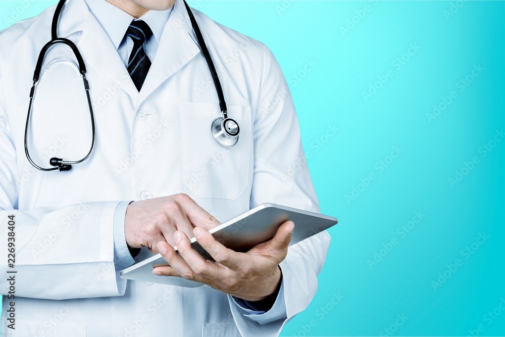 Doctor at hospital working with tablet pc Doctor at hospital working with tablet pc