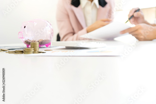 Business man woman hold collect coin in the row in