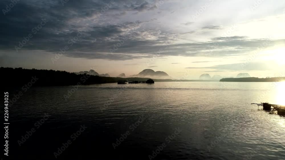 Aerial view drone shot of Beautiful light sunrise in the morning at Ban Sam Chong Tai Village phang-nga province thailand Aerial view drone shot of Beautiful light sunrise in the morning at Ban Sam Chong Tai Village phang-nga province thailand