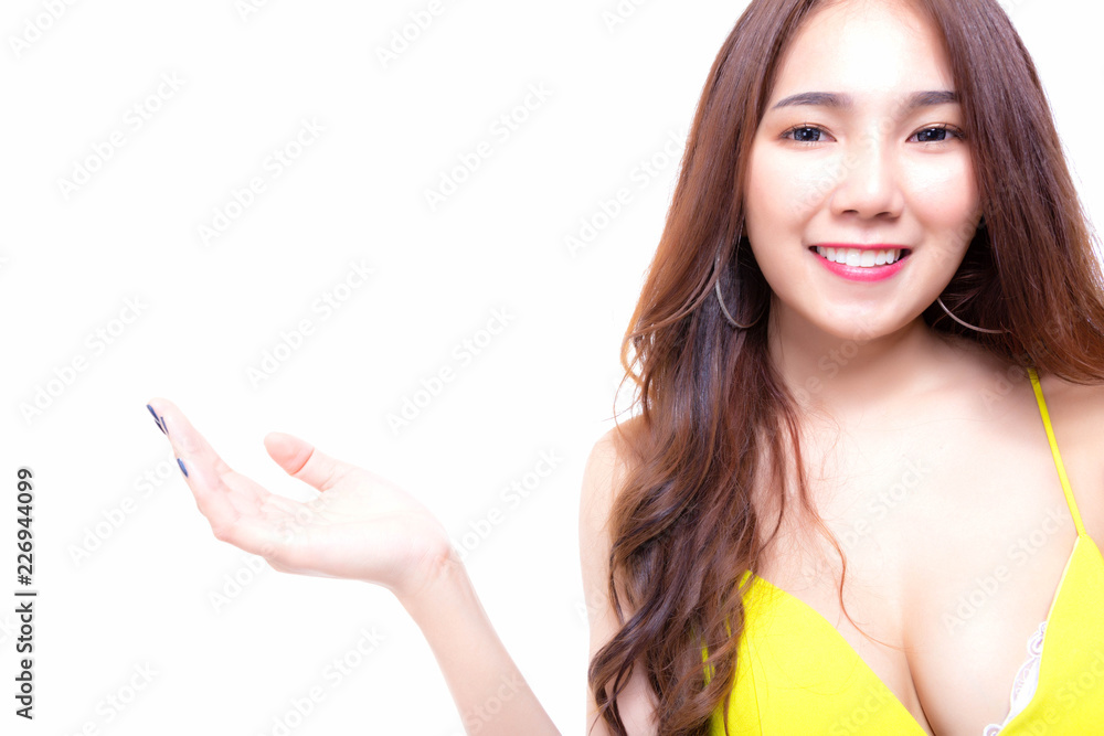 Charming beautiful young woman showing her favorite product, brand, goods. Attractive beautiful sexy woman inviting customer for use it with happy, smile face. isolated on white background copy space Charming beautiful young woman showing her favorite product, brand, goods. Attractive beautiful sexy woman inviting customer for use it with happy, smile face. isolated on white background copy space