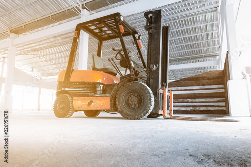 Forklift Truck in Storage Warehouse Ship Yard, Vehicle Factory and Distribution Machine for Products Delivery. Business Industrial Shipping and Logistics Transport. Transportation Machinery photo