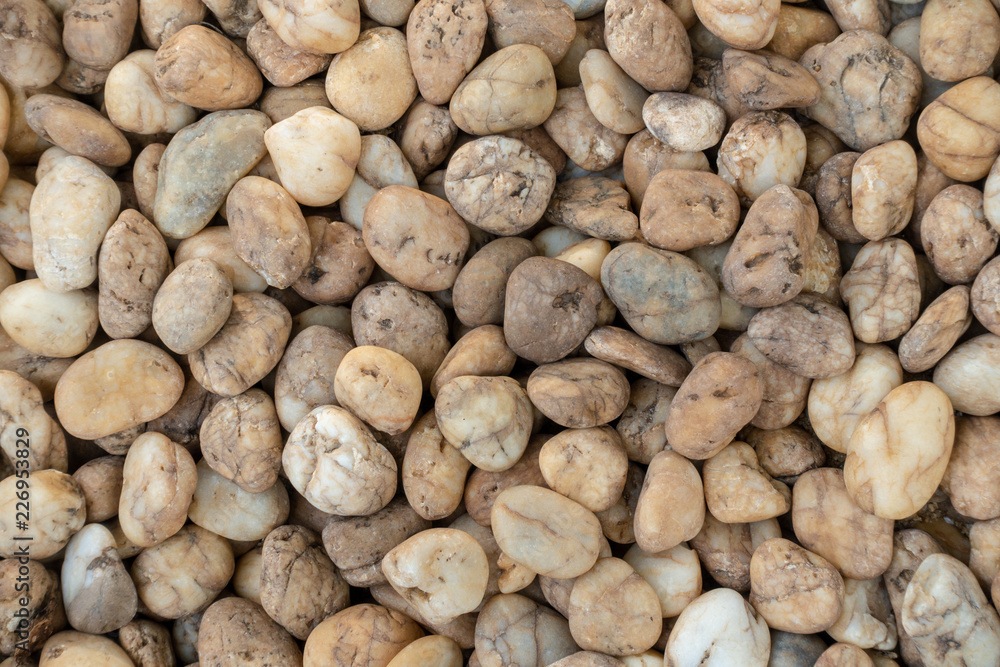 Pebbles stones floor texture for background, garden decoration with pebbles stones Pebbles stones floor texture for background, garden decoration with pebbles stones