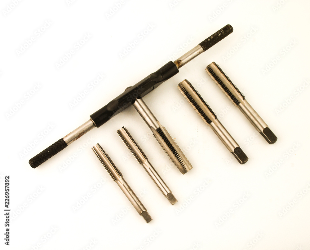 Cutting tool to make thread known as hand tap on white background Cutting tool to make thread known as hand tap on white background