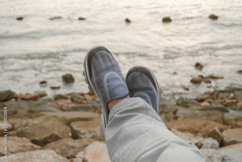feet on the beach. financial freedom concept