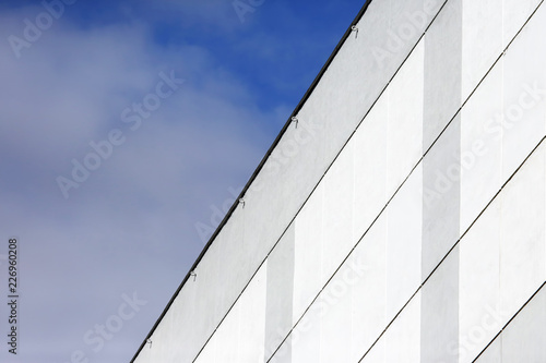 The facade of the building on the background of blue sky