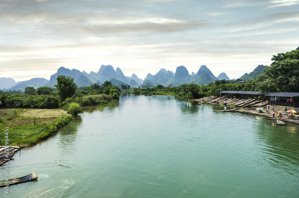 Obraz premium Beautiful karst mountains are visible on blue sky background on summer sunny day.