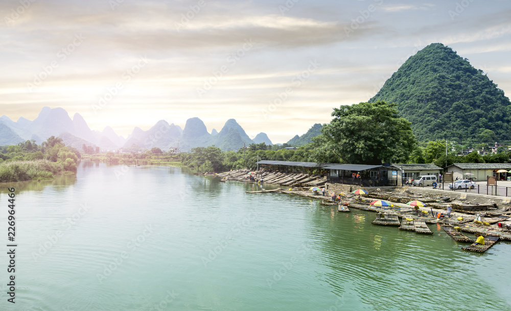 Beautiful karst mountains are visible on blue sky background on summer sunny day.