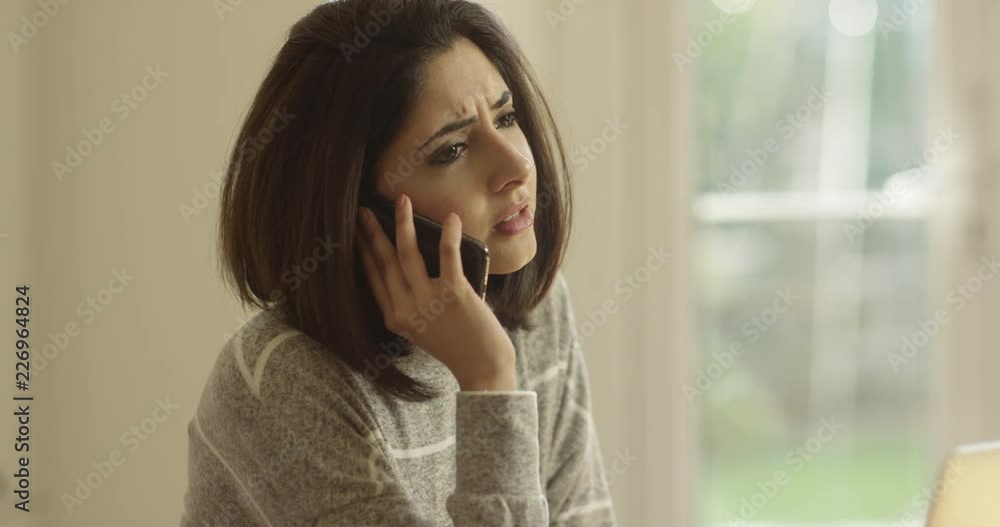 4K Unhappy professional woman dealing with a problem over the phone 4K Unhappy professional woman dealing with a problem over the phone