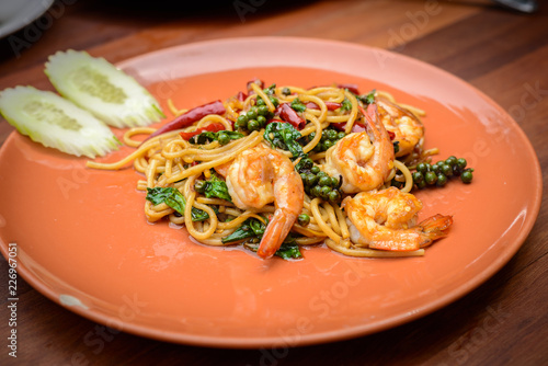 Tableau sur toile Stir-fried Spicy Spaghetti Seafood Thai food Style (Spaghetti Pad Kee Mao) in Or