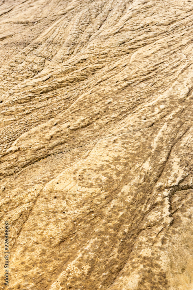 Natural brown rock texture eroded by the water Natural brown rock texture eroded by the water
